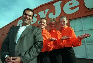 Images Dated 13th October 1997: Stelios Haji-Loannou easyJet boss October 1997 with three stewardesses outside hangar at