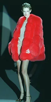 Stella Tennant models a red fur coat and a skimpy dress under it Stella Tennant models a red fur coat and a skimpy dress under it