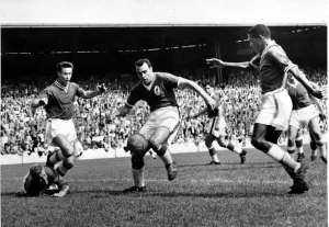 and Steve Mokone battle for the ball in the Liverpool goalmouth during their teams 3-2 and Steve Mokone battle for the ball in the Liverpool goalmouth during their teams 3-2