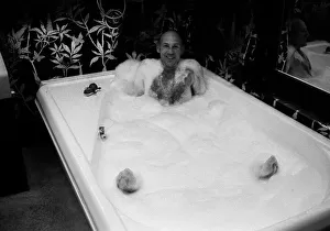Stirling Moss in bath at his new home 1978 Stirling Moss in bath at his new home 1978