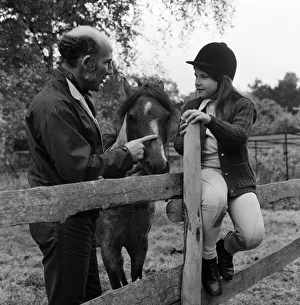 Stirling Moss and his daughter Allison (aged 7) with her horse Happy Stirling Moss and his daughter Allison (aged 7) with her horse Happy