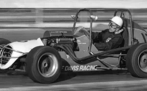 Stirling Moss rying out midget racing car at White City racing track - December 1971 Stirling Moss rying out midget racing car at White City racing track - December 1971