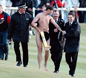 Streaker is arrested by the police after running on to the Old Course at St Andrews Streaker is arrested by the police after running on to the Old Course at St Andrews