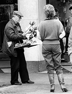 A street trader selling flowers on Northumberland Street, Newcastle on 19th October 1984 A street trader selling flowers on Northumberland Street, Newcastle on 19th October 1984