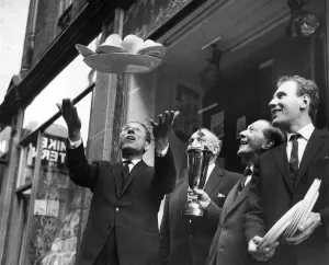 Street Traders: Sid Strong throws aloft a tray full of cups and saucers Street Traders: Sid Strong throws aloft a tray full of cups and saucers