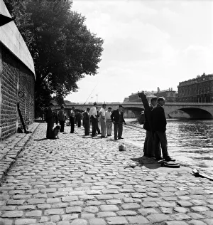 Strike: Frenchmen fishing in the River Seine, Paris during the general strike Strike: Frenchmen fishing in the River Seine, Paris during the general strike