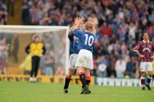 Stuart McCall Rangers football payer gives a Gordon Durie ten after their victory over Stuart McCall Rangers football payer gives a Gordon Durie ten after their victory over