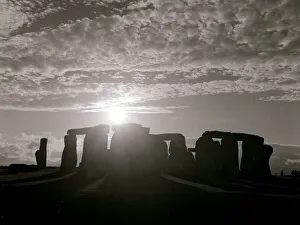 The sun as it rises above Stonehenge in Wiltshire south west England on the day of The sun as it rises above Stonehenge in Wiltshire south west England on the day of