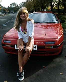 Suzanne Mizzi Model sitting on red car A©Mirrorpix Suzanne Mizzi Model sitting on red car A©Mirrorpix