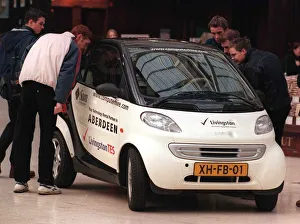 Swatch smart car in Glasgow central station January 1999 crowd looking in Swatch smart car in Glasgow central station January 1999 crowd looking in