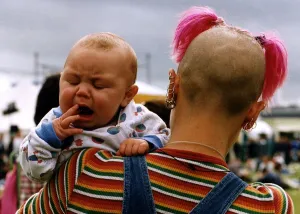 T in the Park Music Festival fan with yawning baby T in the Park Music Festival fan with yawning baby
