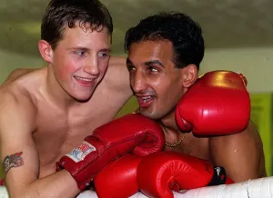 Tanveer Ahmed Glasgow lightweight Boxer with his arms round sparring partner Scott Dixon Tanveer Ahmed Glasgow lightweight Boxer with his arms round sparring partner Scott Dixon