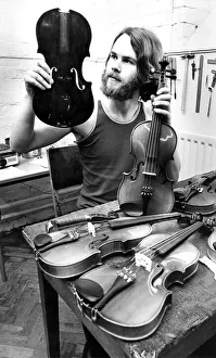 Tarquin Bolton at the Sunderland Violin Hospital in July 1980 set up to repair damaged Tarquin Bolton at the Sunderland Violin Hospital in July 1980 set up to repair damaged