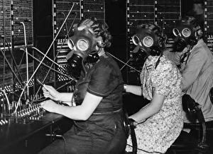 Telephone girls at Whitley Bay Post Office try out the gas masks as they prepare for any Telephone girls at Whitley Bay Post Office try out the gas masks as they prepare for any