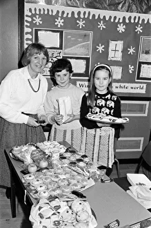 Ten-year-old Sarah Hanson (centre) serves customer Mrs Irena Wegrzyn at a bring Ten-year-old Sarah Hanson (centre) serves customer Mrs Irena Wegrzyn at a bring
