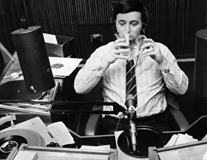 Terry Wogan drinking a jug of water during his record programme on Radio One Terry Wogan drinking a jug of water during his record programme on Radio One