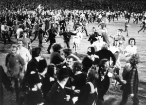 Thousands of Birmingham City fans swarm onto the pitch after their team clinched Thousands of Birmingham City fans swarm onto the pitch after their team clinched
