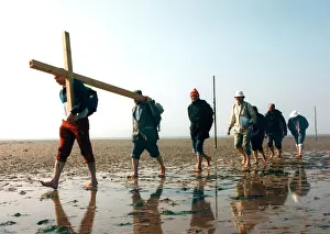 Tim cooke, far left, leads the group from Hexham, across the causeway at Holy Island Tim cooke, far left, leads the group from Hexham, across the causeway at Holy Island