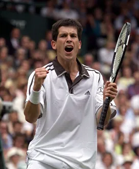 Tim Henman celebrates victory over Jim Courier in the fourth round mens single' Tim Henman celebrates victory over Jim Courier in the fourth round mens single'