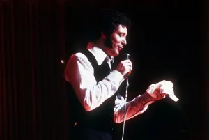 Tom Jones singer singing microphone open necked shirt waistcoat hankerchief Tom Jones singer singing microphone open necked shirt waistcoat hankerchief