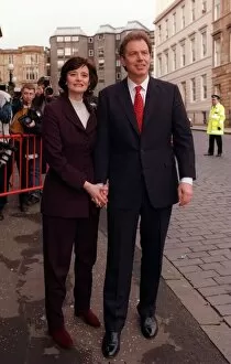 Images Dated 4th April 1997: Tony Blair holding hands with wife Cherie while walking through streets of Glasgow 1997