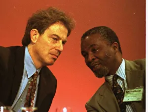 Tony Blair leans over on the platform to talk with Thabo Mebeki of South Africa at Tony Blair leans over on the platform to talk with Thabo Mebeki of South Africa at
