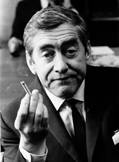 Tony Hancock holding up a lit cigarette August 1966 Tony Hancock holding up a lit cigarette August 1966
