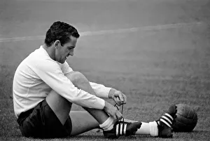 Tottenham Hotspur player Dave Mackay ties up his boot laces during a pre-season training Tottenham Hotspur player Dave Mackay ties up his boot laces during a pre-season training
