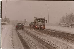 Images Dated 5th December 1995: Traffic driving along a snow covered road in kent after Britain was hit by the Big Freeze
