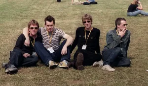 Travis at T in the Park sitting on the grass 2 members are smoking July 1999 Travis at T in the Park sitting on the grass 2 members are smoking July 1999