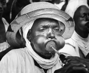A tribesman from Bida in Northern Nigeria blowing his trumpet as part of the reception A tribesman from Bida in Northern Nigeria blowing his trumpet as part of the reception