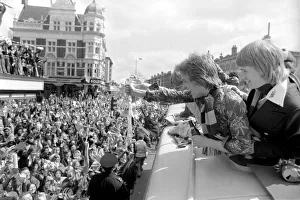 Triumphant West Ham players parade the FA cup trophy to their fans from an open top Triumphant West Ham players parade the FA cup trophy to their fans from an open top