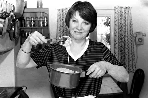 Tv cook Delia Smith at home in kitchen 1981 Mixing with a whisk Tv cook Delia Smith at home in kitchen 1981 Mixing with a whisk