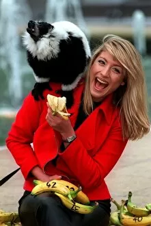 Images Dated 25th January 1996: TV presenter Dani Behr and dana the lemur select their fruity numbers for this weeks 42m