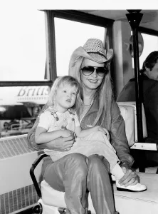 Twiggy actress with her daughter Carly arriving at Heathrow Airport from LA. June 1981 Twiggy actress with her daughter Carly arriving at Heathrow Airport from LA. June 1981