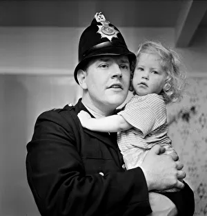 Two-year-old Deborah Almond, and PC Brian Corner, who rescued the toddler from a river Two-year-old Deborah Almond, and PC Brian Corner, who rescued the toddler from a river