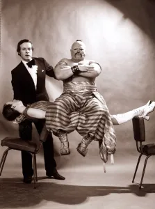 Unusual - Magic Magician Hypnoist Romark performing a trick where his assistant floats Unusual - Magic Magician Hypnoist Romark performing a trick where his assistant floats
