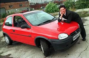 Vauxhall Corsa red August 1998 Man leaning on bonnet Vauxhall Corsa red August 1998 Man leaning on bonnet