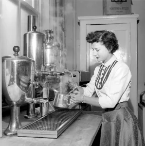 Waitress/woman seen here preparing pots of tea in a cafe. 1957 A17b-002 Waitress/woman seen here preparing pots of tea in a cafe. 1957 A17b-002