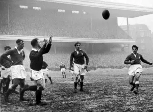 Wales v Scotland - 1956 - Rugby - Wales centre Malcolm Thomas clears to touch under Wales v Scotland - 1956 - Rugby - Wales centre Malcolm Thomas clears to touch under