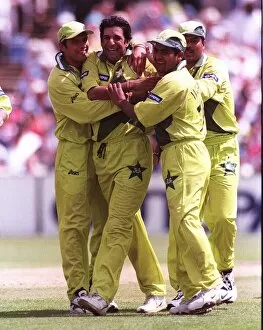 Images Dated 16th June 1999: Wasim Akram is mobbed after getting the wicket June 1999 of Craig McMillan during