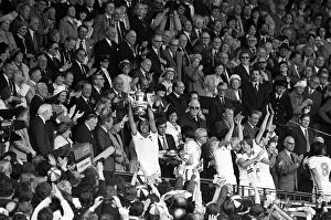 Images Dated 10th May 1980: West Ham Captain Billy Bonds holds up the FA Cup after the Presentation Hammers had