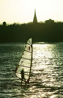 A windsurfer enjoys the sunshine despite the freezing temperatures on Edgbaston Reservoir A windsurfer enjoys the sunshine despite the freezing temperatures on Edgbaston Reservoir