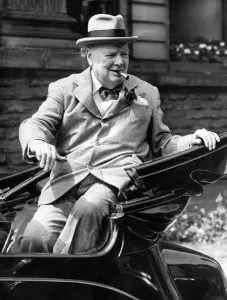 Winston Churchill smiles at the cheering crowds as he leaves the Town Hall on his visit Winston Churchill smiles at the cheering crowds as he leaves the Town Hall on his visit
