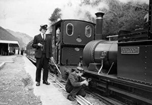 Images Dated 22nd April 1976: A woker applying some oil to one of the steam trains on the Talyllyn railway line which