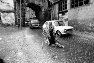 Woman and child in the streets in a poor suburb on the outskirts of Rome Woman and child in the streets in a poor suburb on the outskirts of Rome