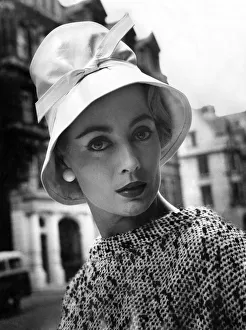 A woman modelling a fashionable hat. July 1957 A woman modelling a fashionable hat. July 1957