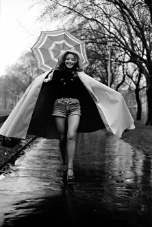 Images Dated 28th January 1975: Woman / Umbrella / Humour: Actress Cheryl Gilham. January 1975 75-00534-003