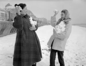 Two women having a snowball fight on Hastings beach. 8th March 1955 Two women having a snowball fight on Hastings beach. 8th March 1955