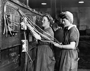 Women wiring up warship which nears completion in a Scottish Shipyard Women wiring up warship which nears completion in a Scottish Shipyard